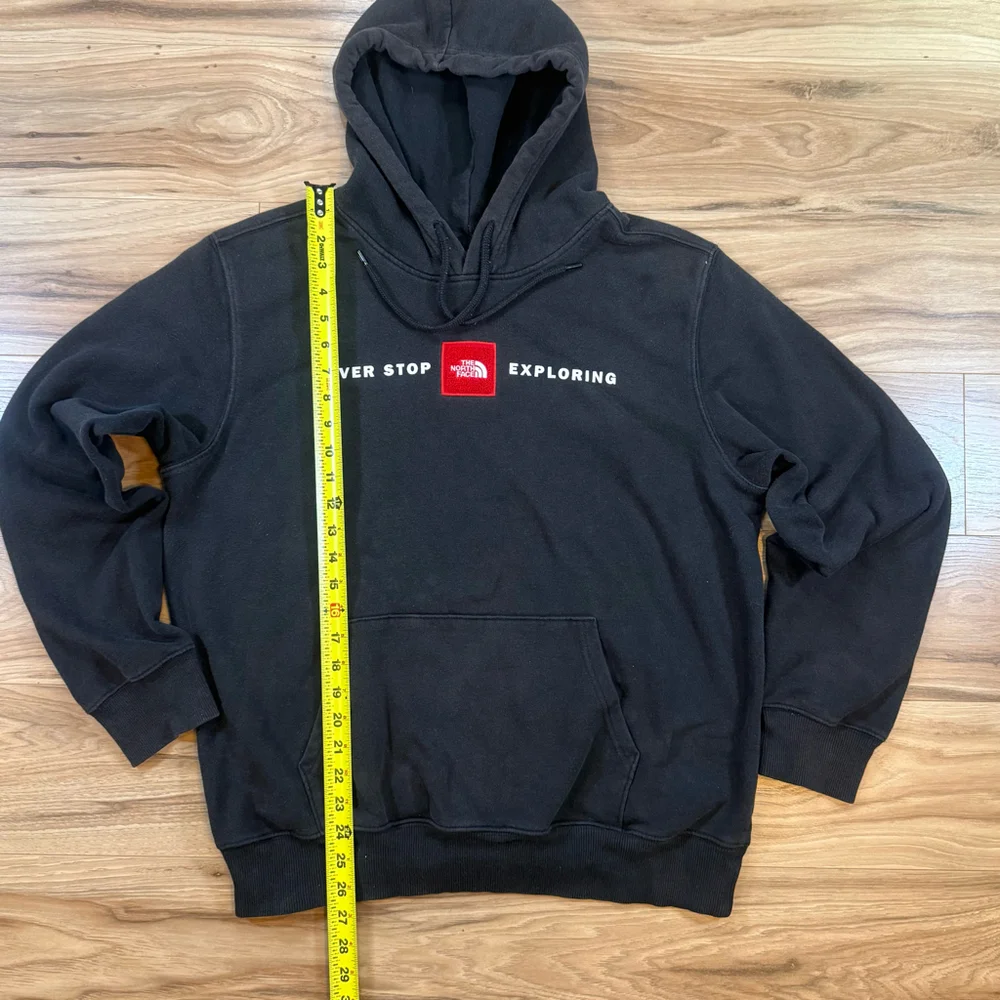 The North Face Black Hoodie with Red Logo Patch
